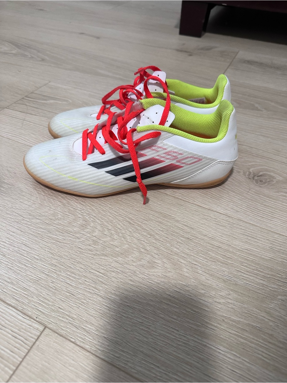 adidas White Indoor Soccer Shoes with Red Laces and Neon Green Lining